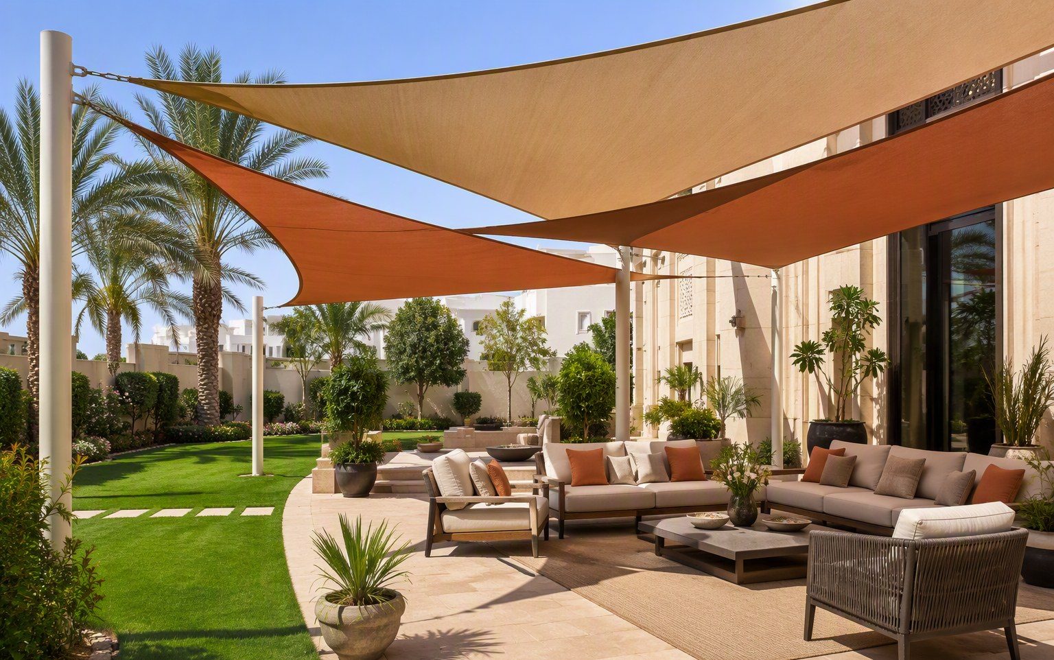 Overlapping garden shade sails over a villa lounge area in the UAE by Al Hamra Industries