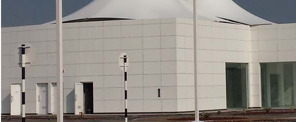 ADNOC service station building with tensile roof canopies