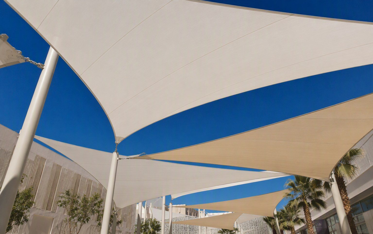 Overlapping sail type shades transforming a UAE courtyard garden